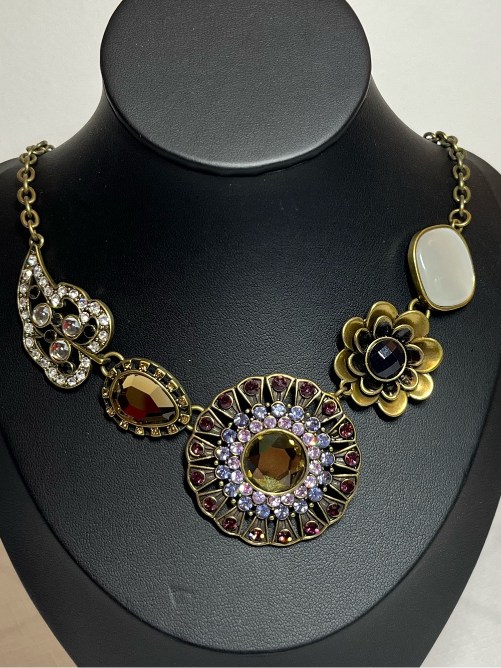 Floral & Medallion Necklace in Gold with Amber and White Accents
Bold
Statement